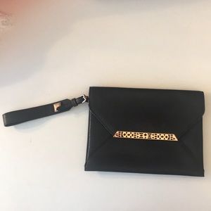 Black and rose gold clutch.